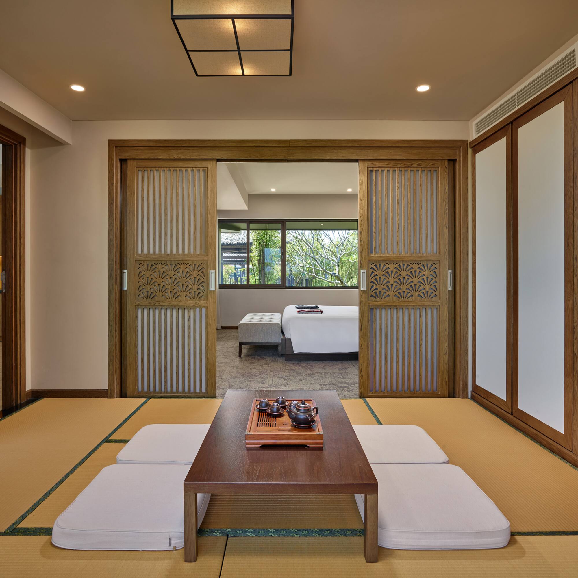 a room with a table and a bed