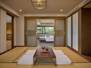 a room with a table and a bed