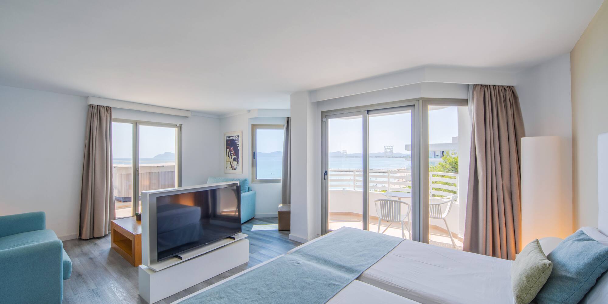 a room with a television and a bed