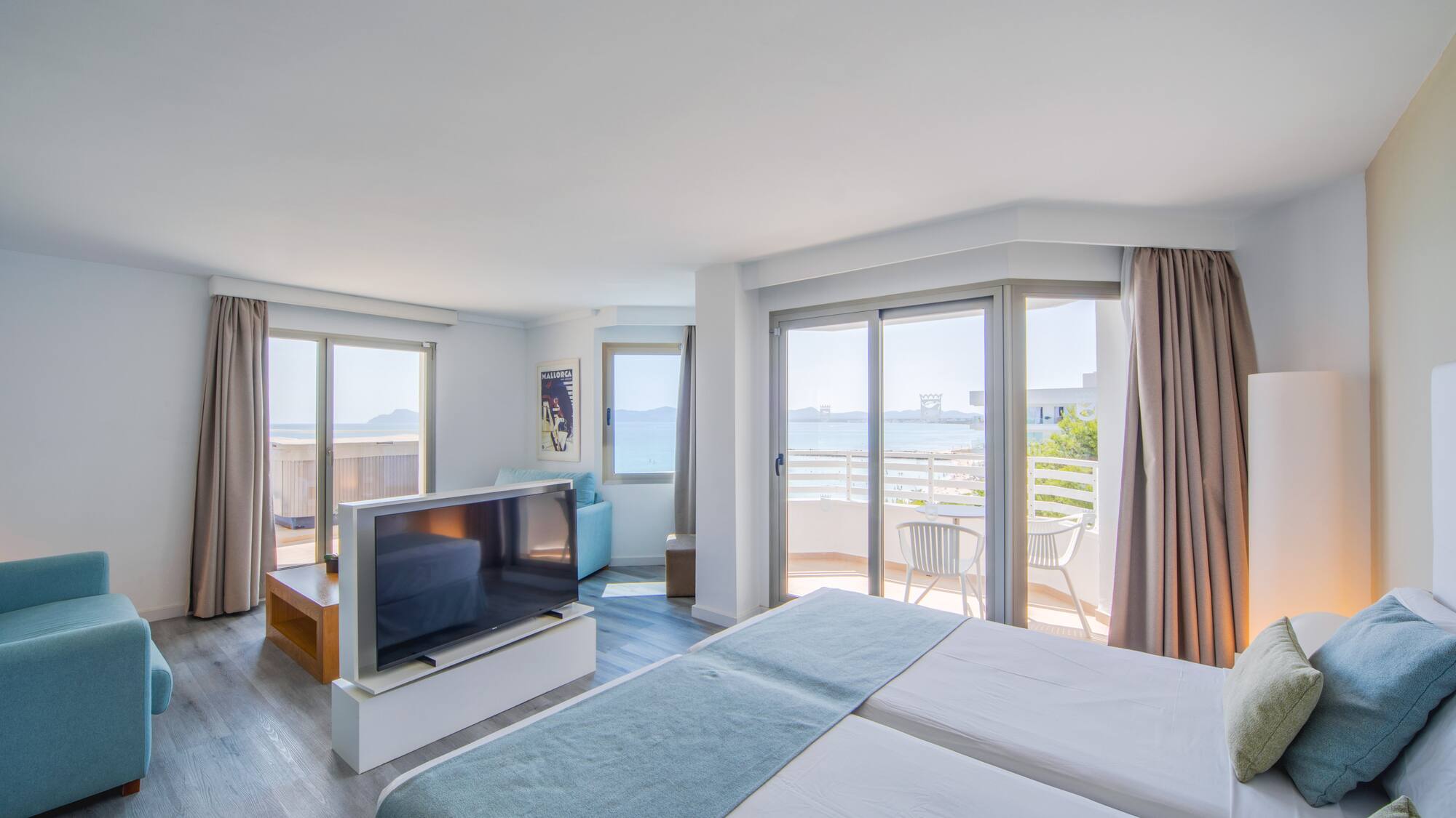 a room with a television and a bed