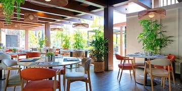 a restaurant with tables and chairs