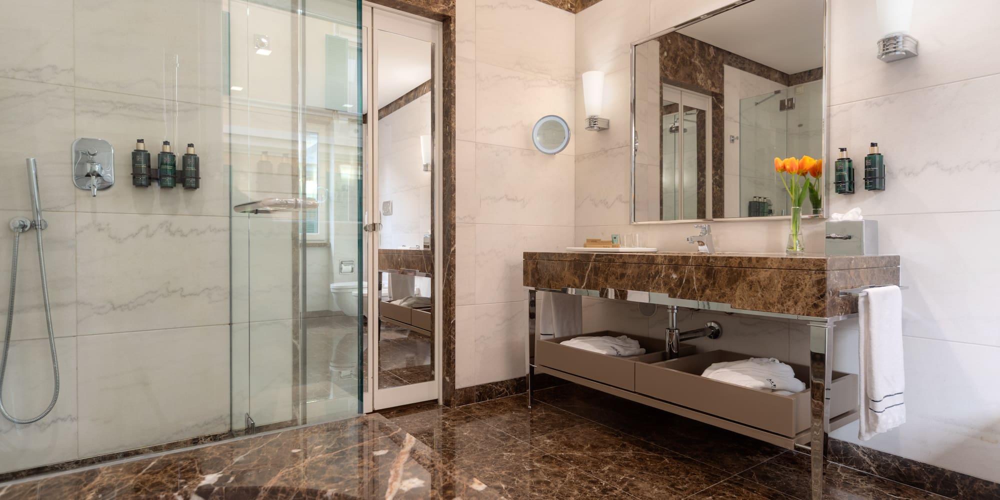 a bathroom with a marble countertop and a sink