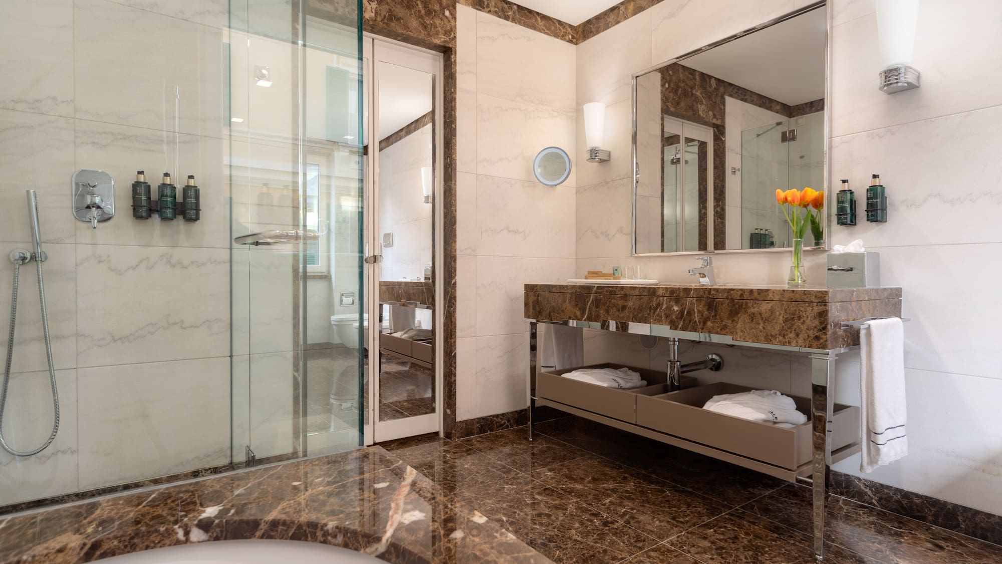 a bathroom with a marble countertop and a sink