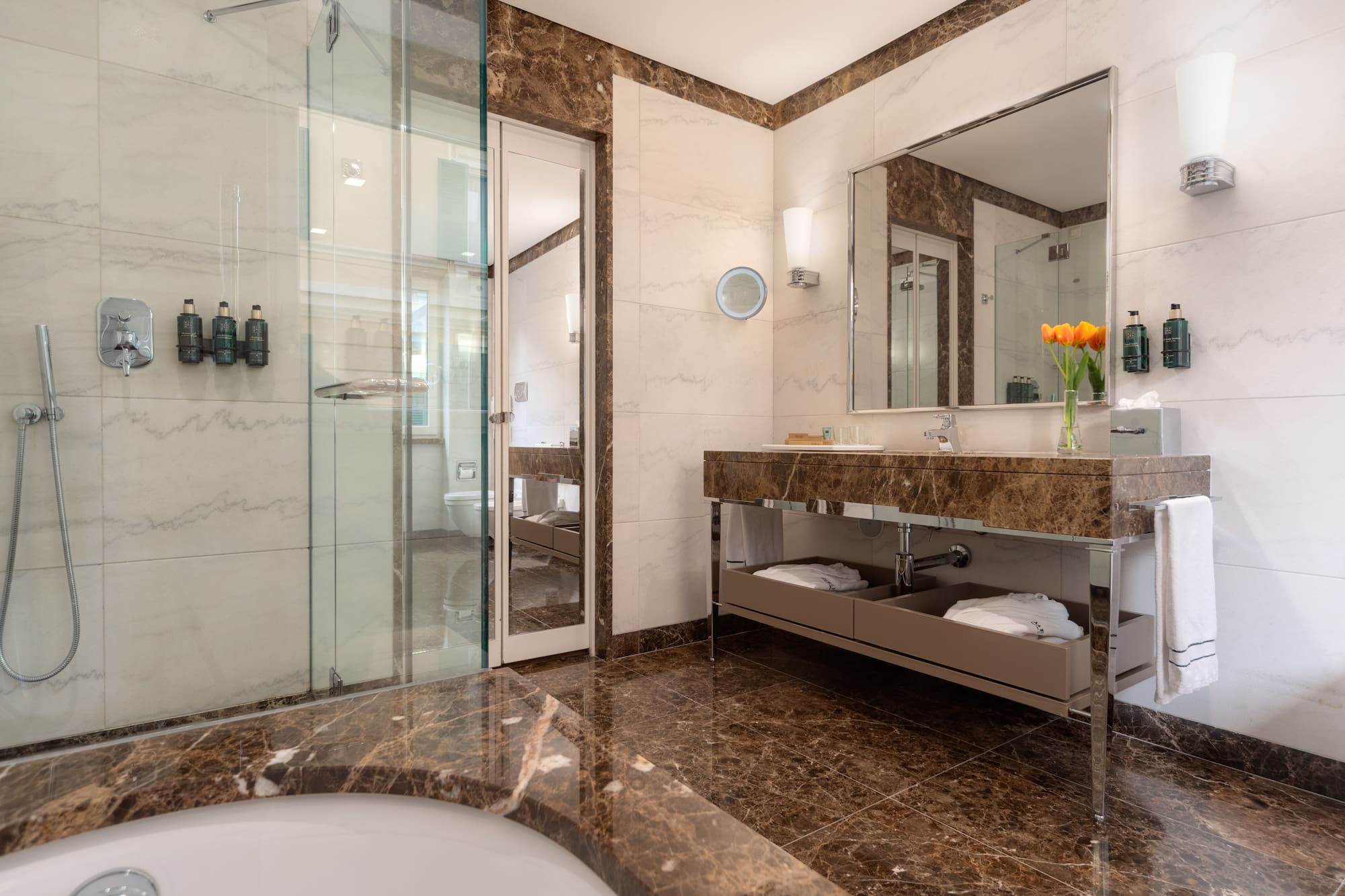 a bathroom with a marble countertop and a sink