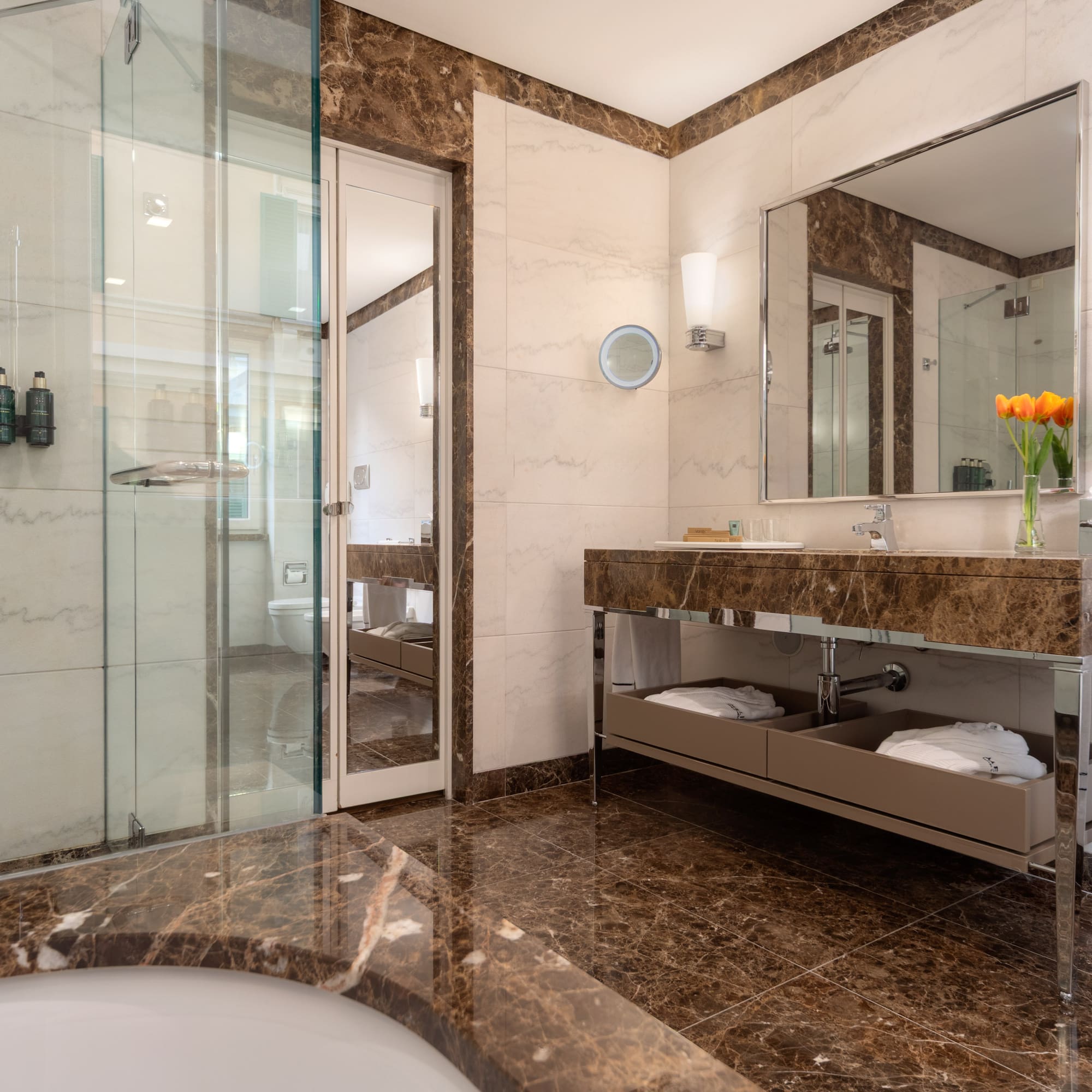 a bathroom with a marble countertop and a sink