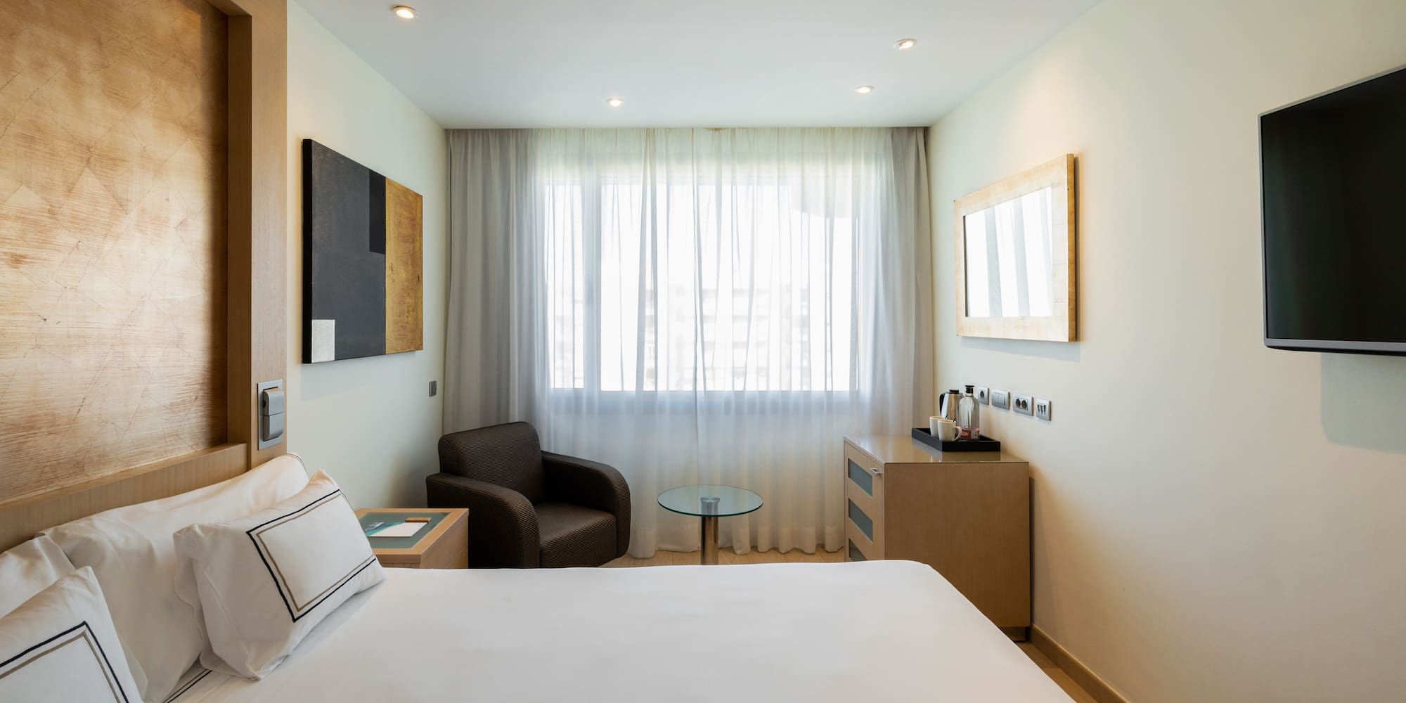 a room with a bed and a chair