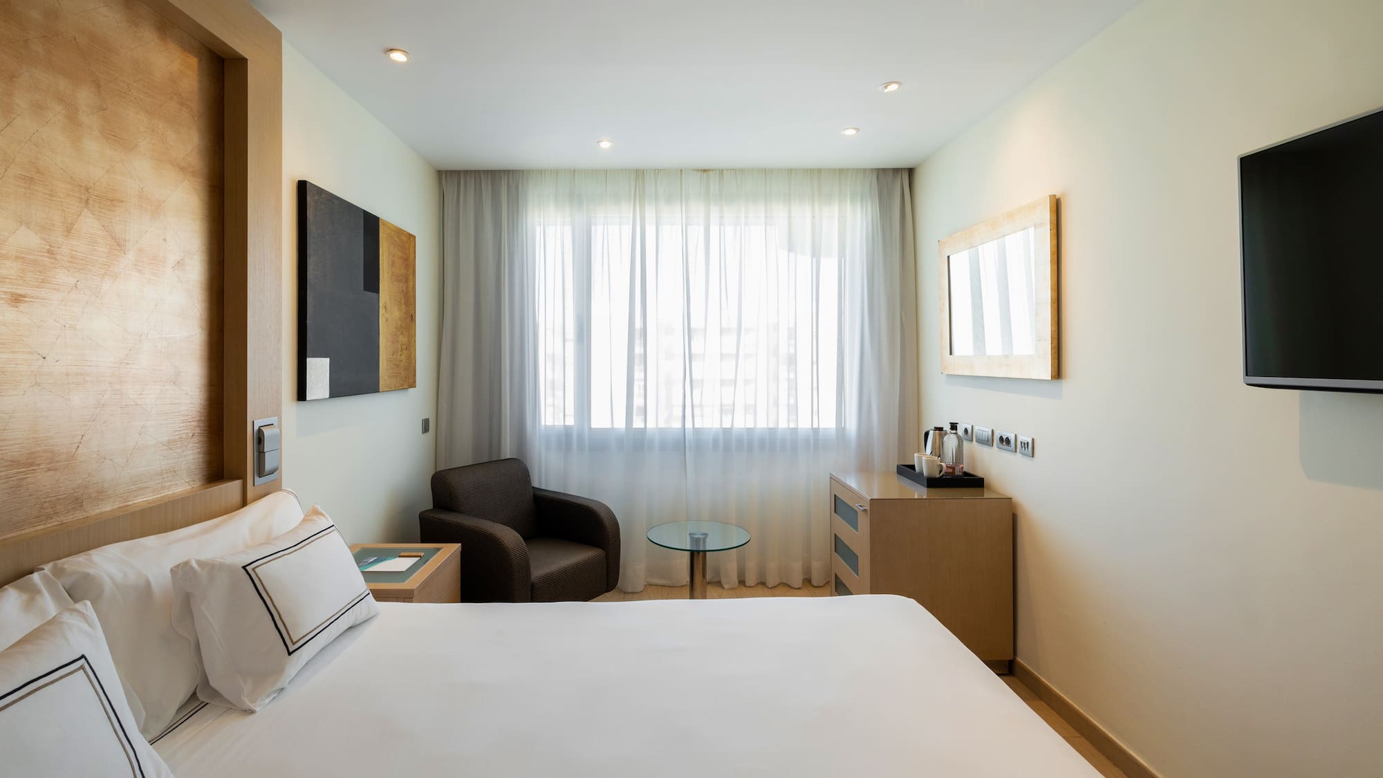 a room with a bed and a chair