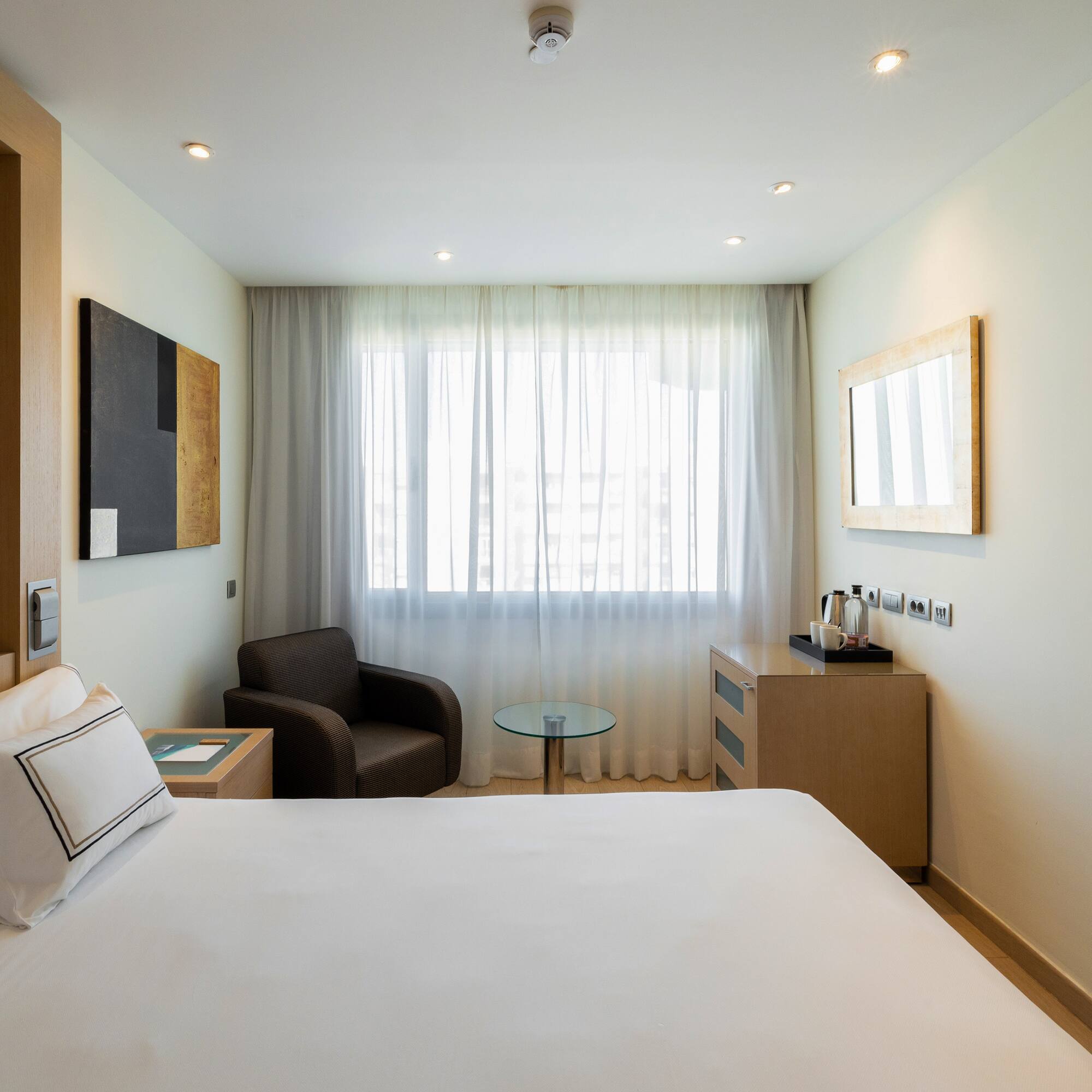 a room with a bed and a chair