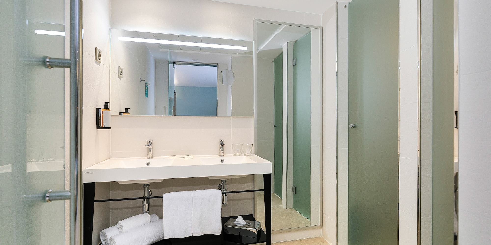 a bathroom with a sink and a shower