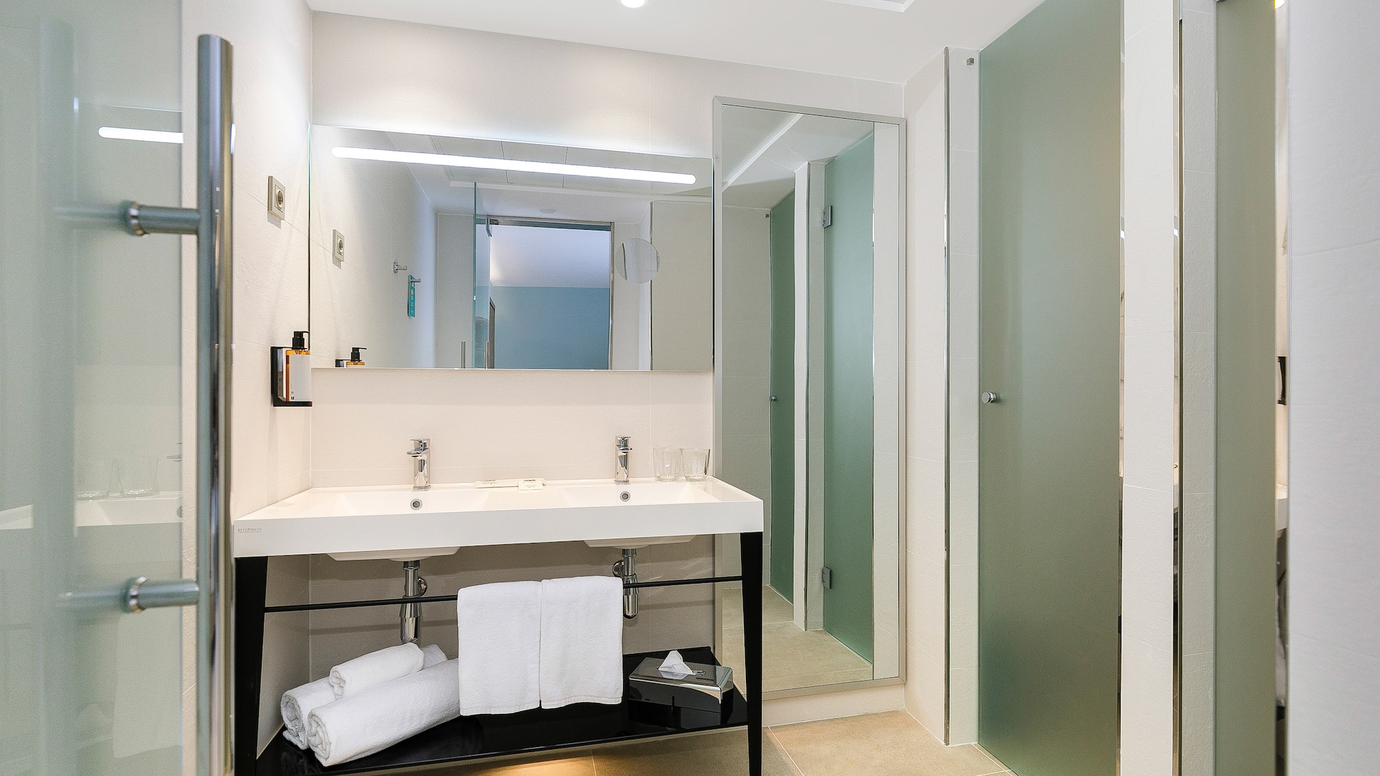 a bathroom with a sink and a shower