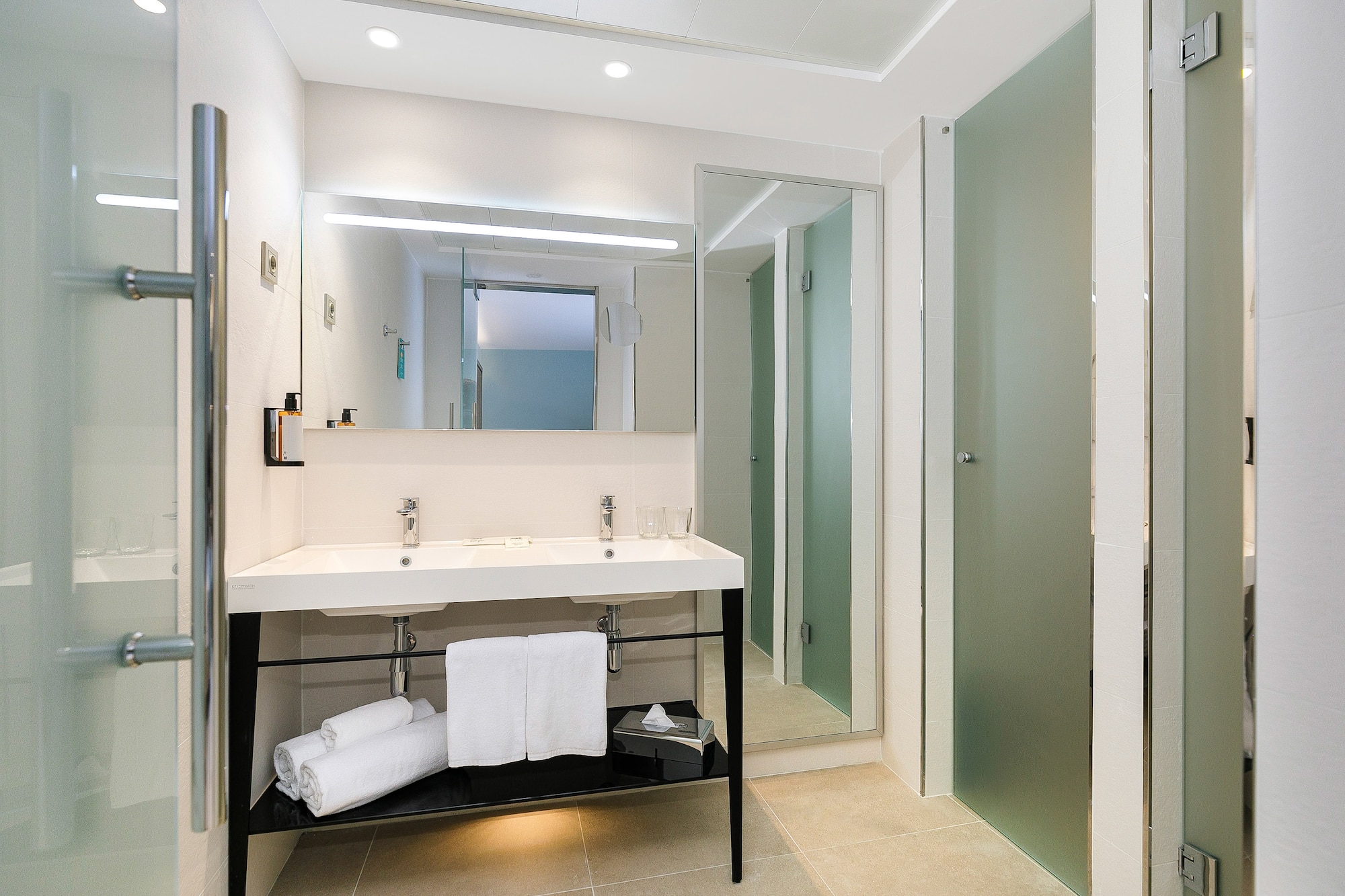 a bathroom with a sink and a shower