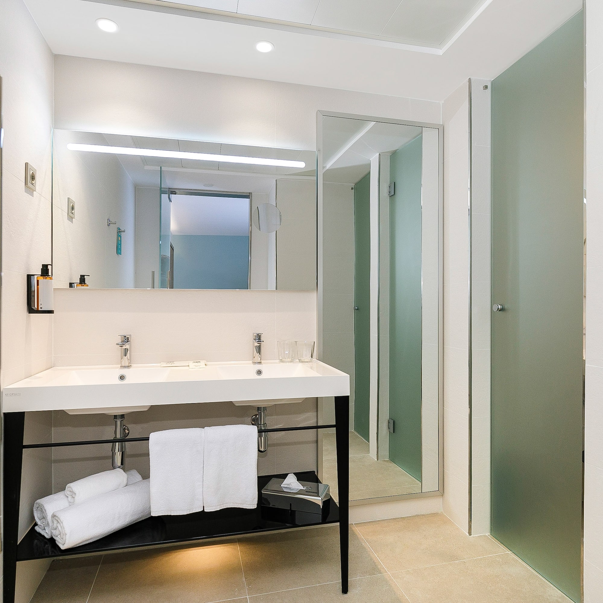 a bathroom with a sink and a shower