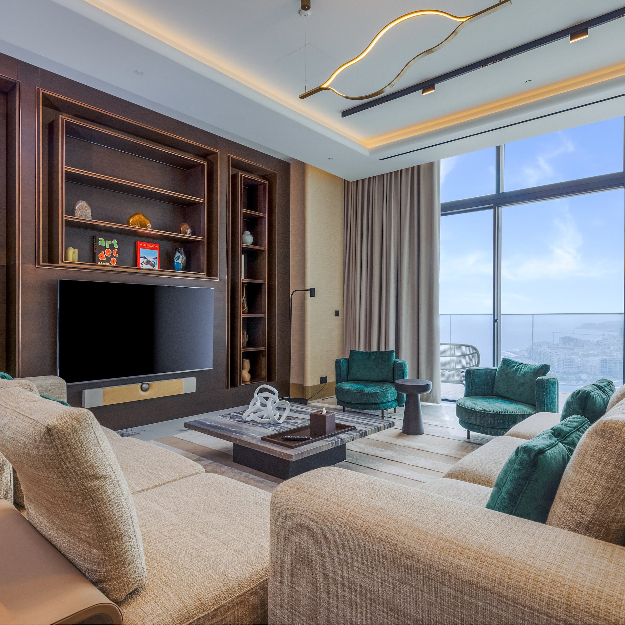 Modern living room with sofa, media center, and panoramic city view windows.
