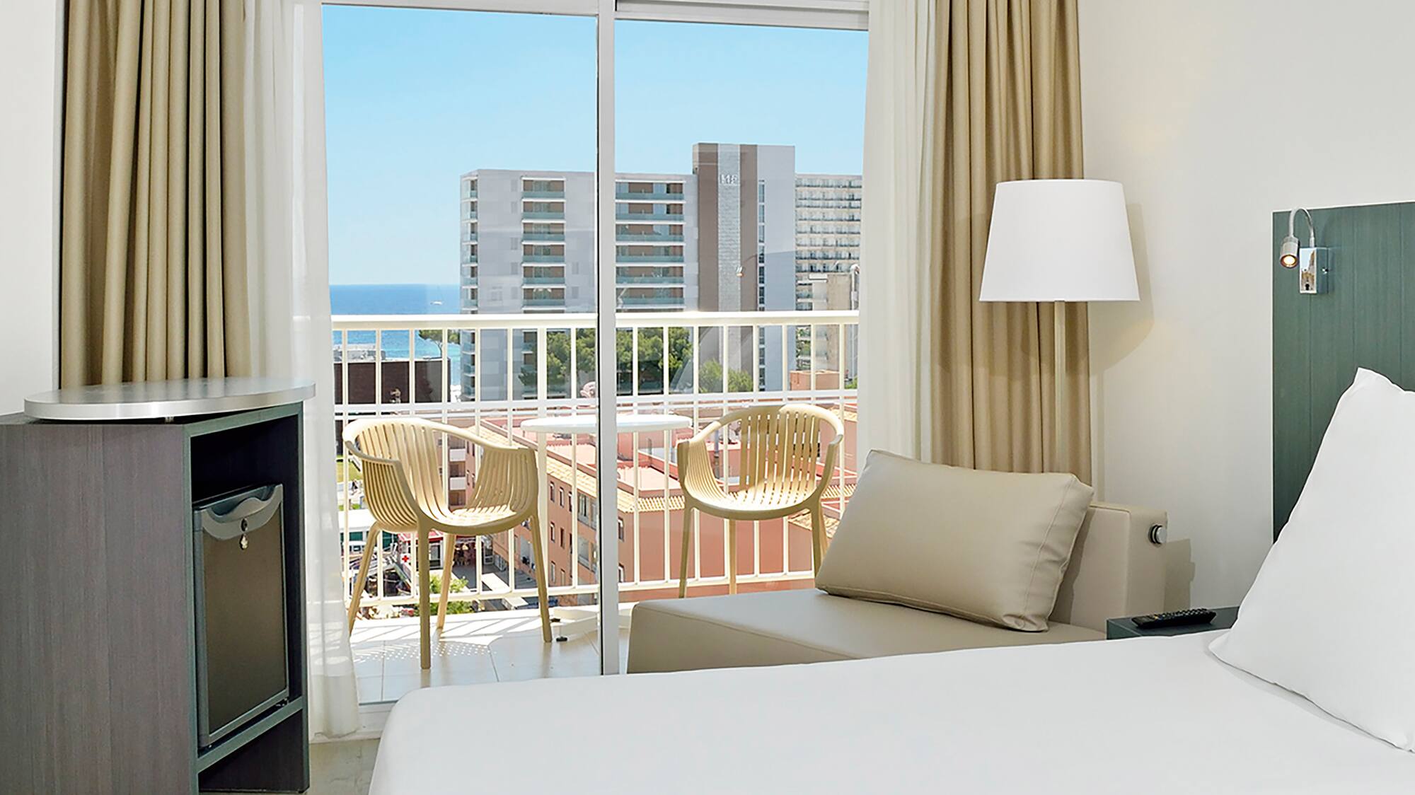 a room with a bed and a balcony