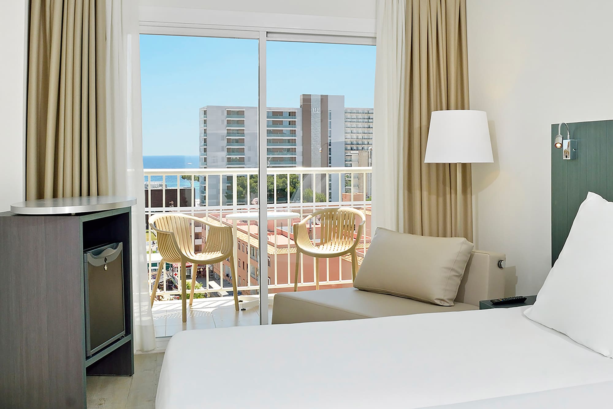 a room with a bed and a balcony