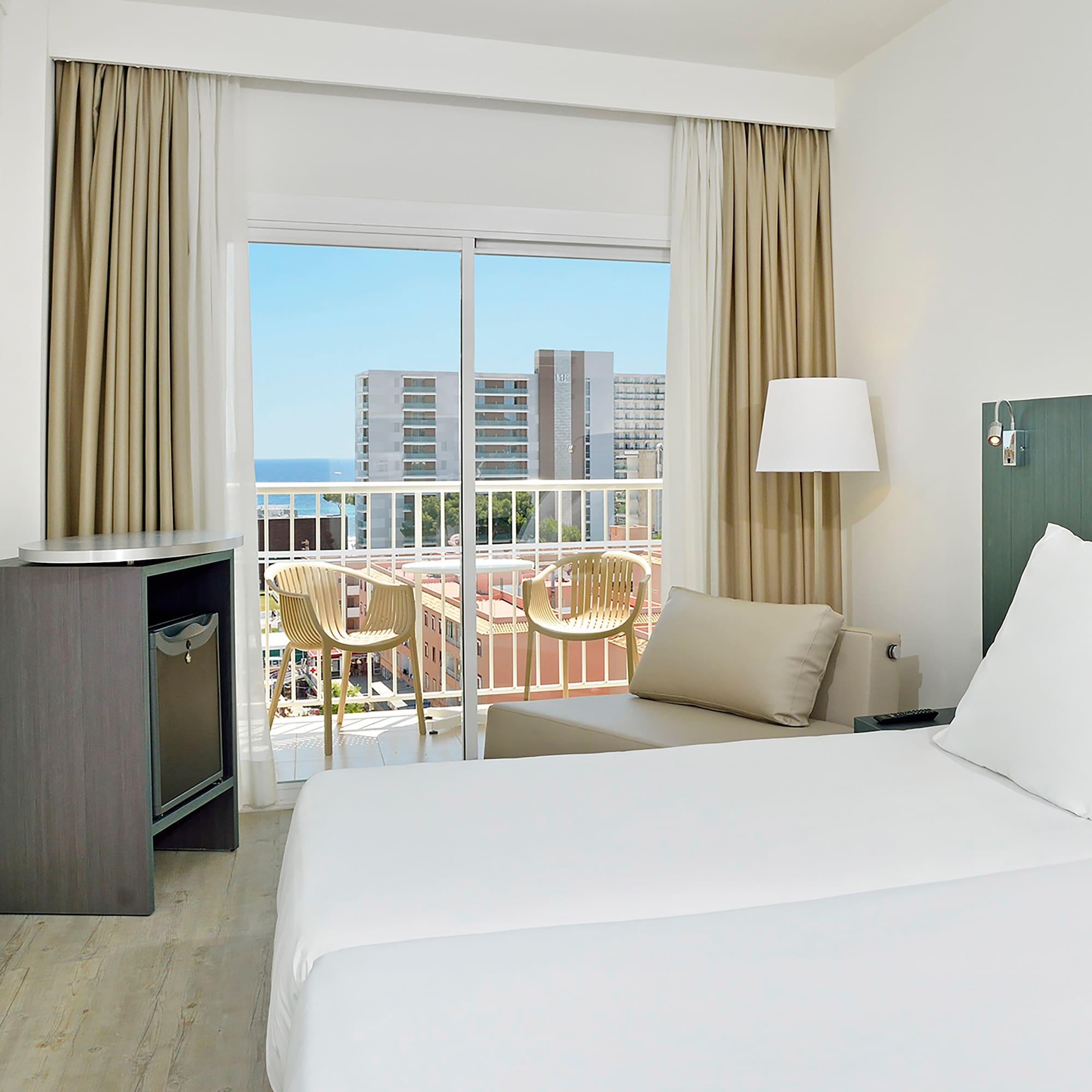 a room with a bed and a balcony