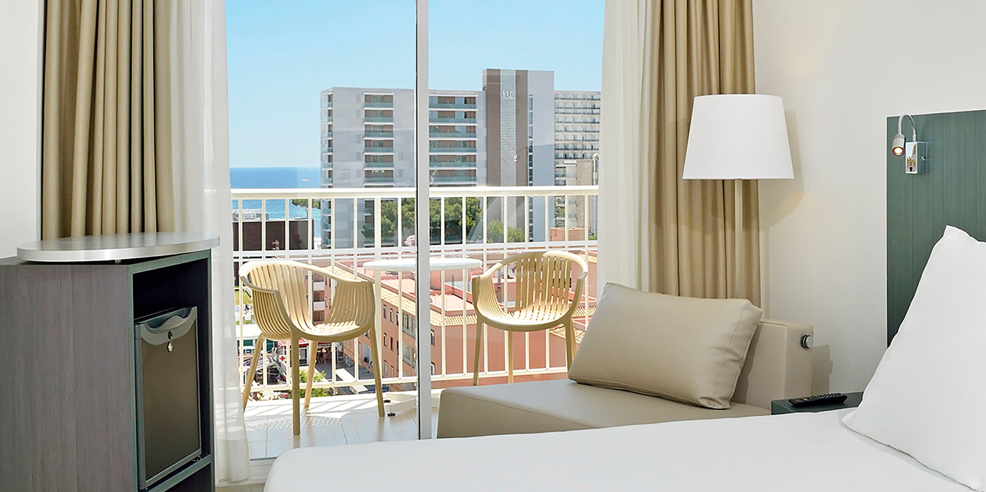 a room with a bed and a balcony