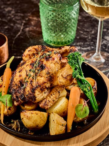 a plate of food and a glass of wine