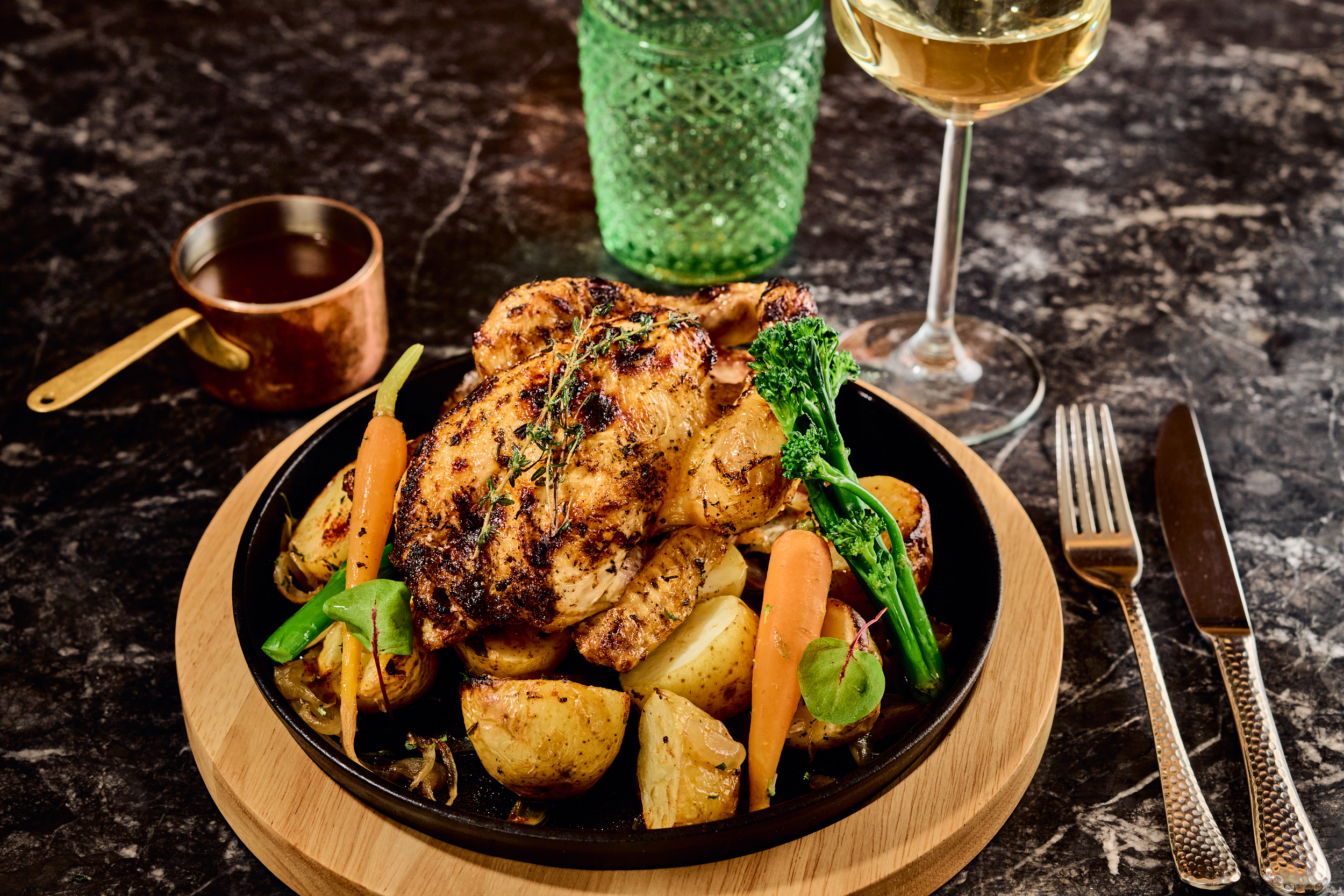 a plate of food and a glass of wine