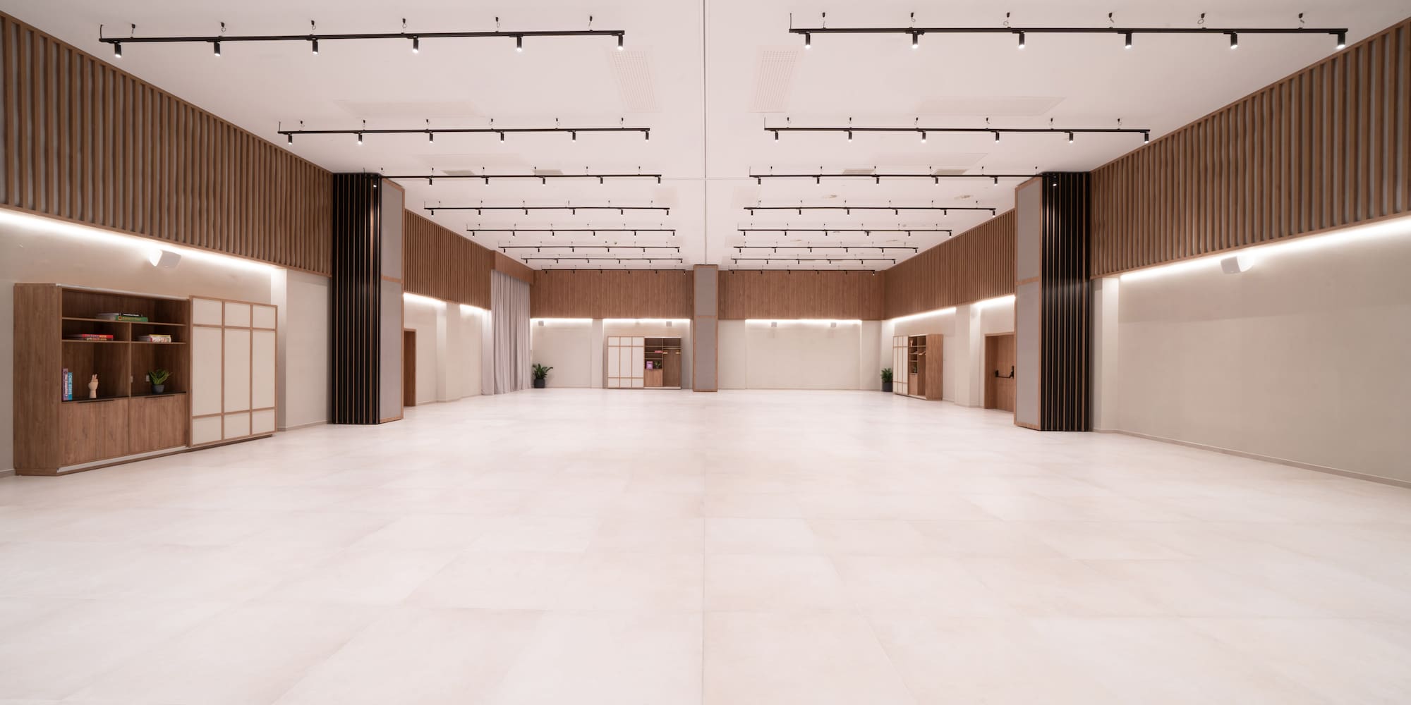 a large room with white tile floor
