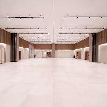 a large room with white tile floor