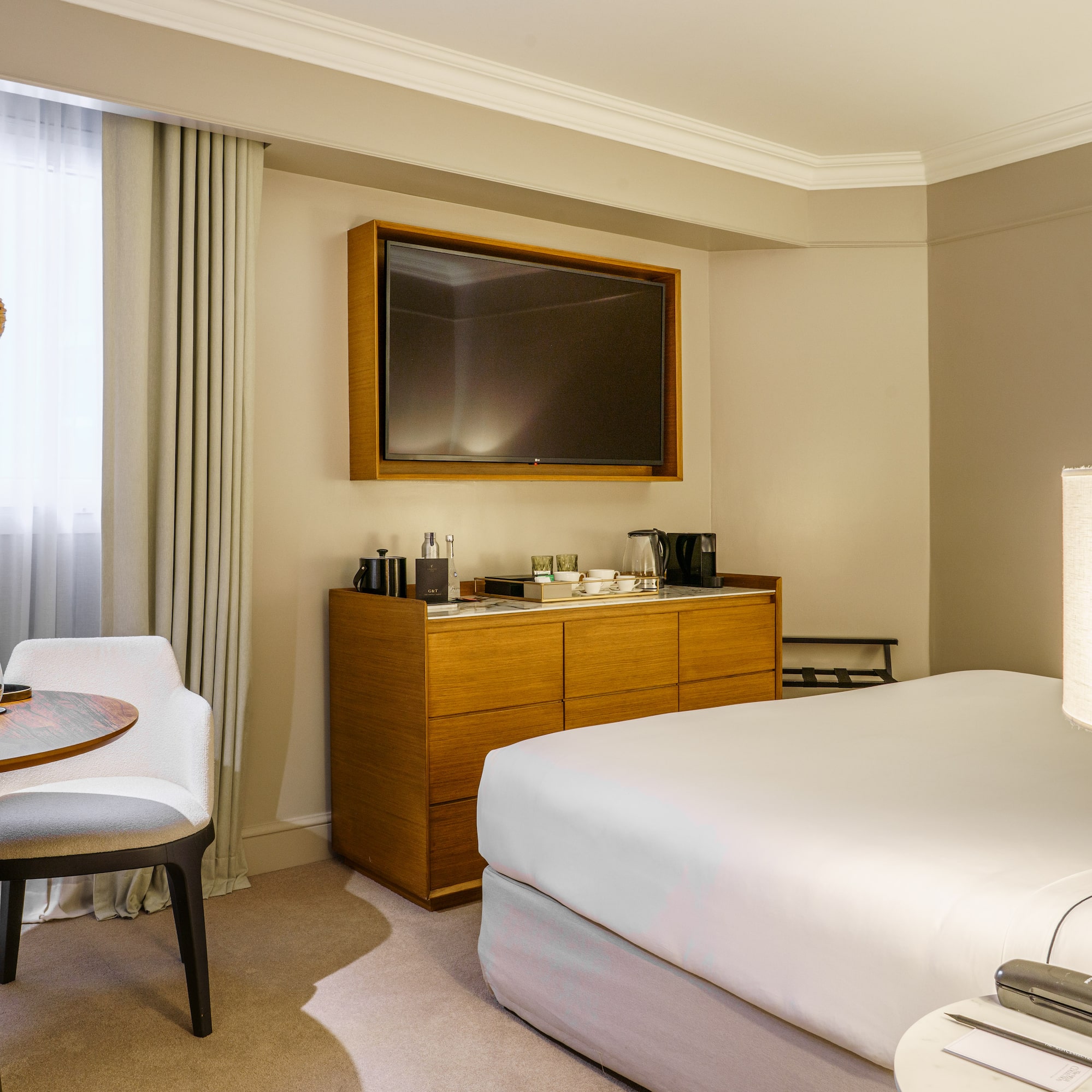 a room with a bed and a tv