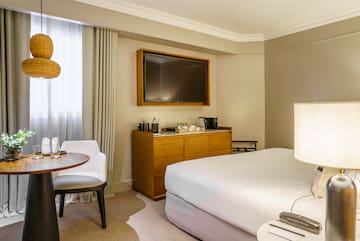 a room with a bed and a tv