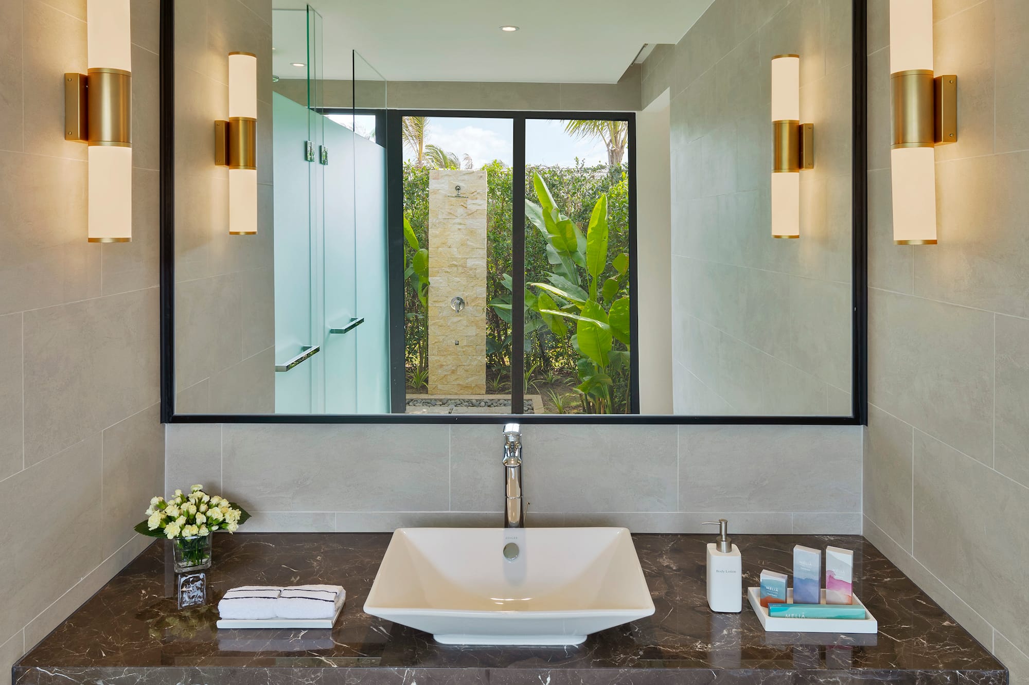 a bathroom with a mirror and sink