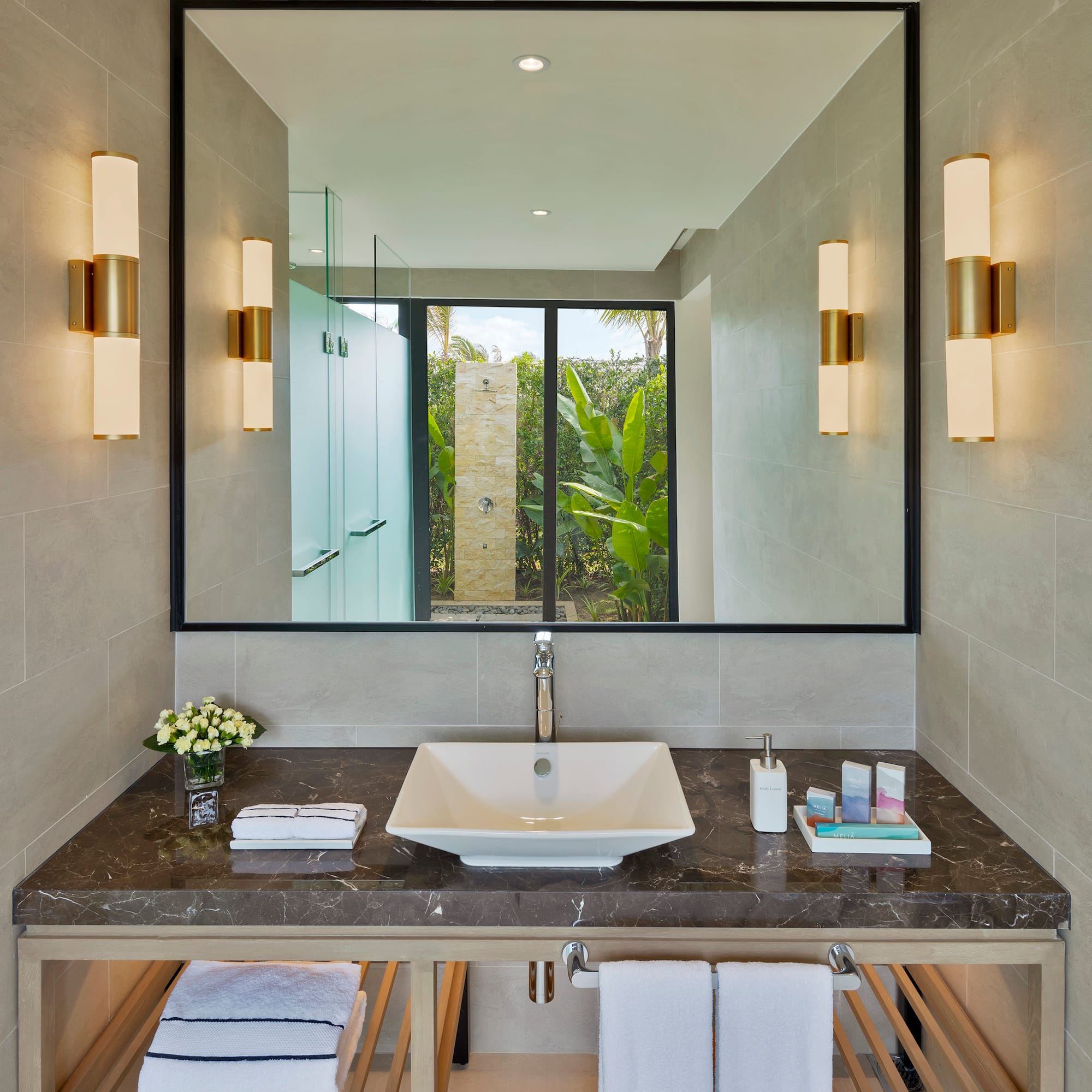 a bathroom with a mirror and sink