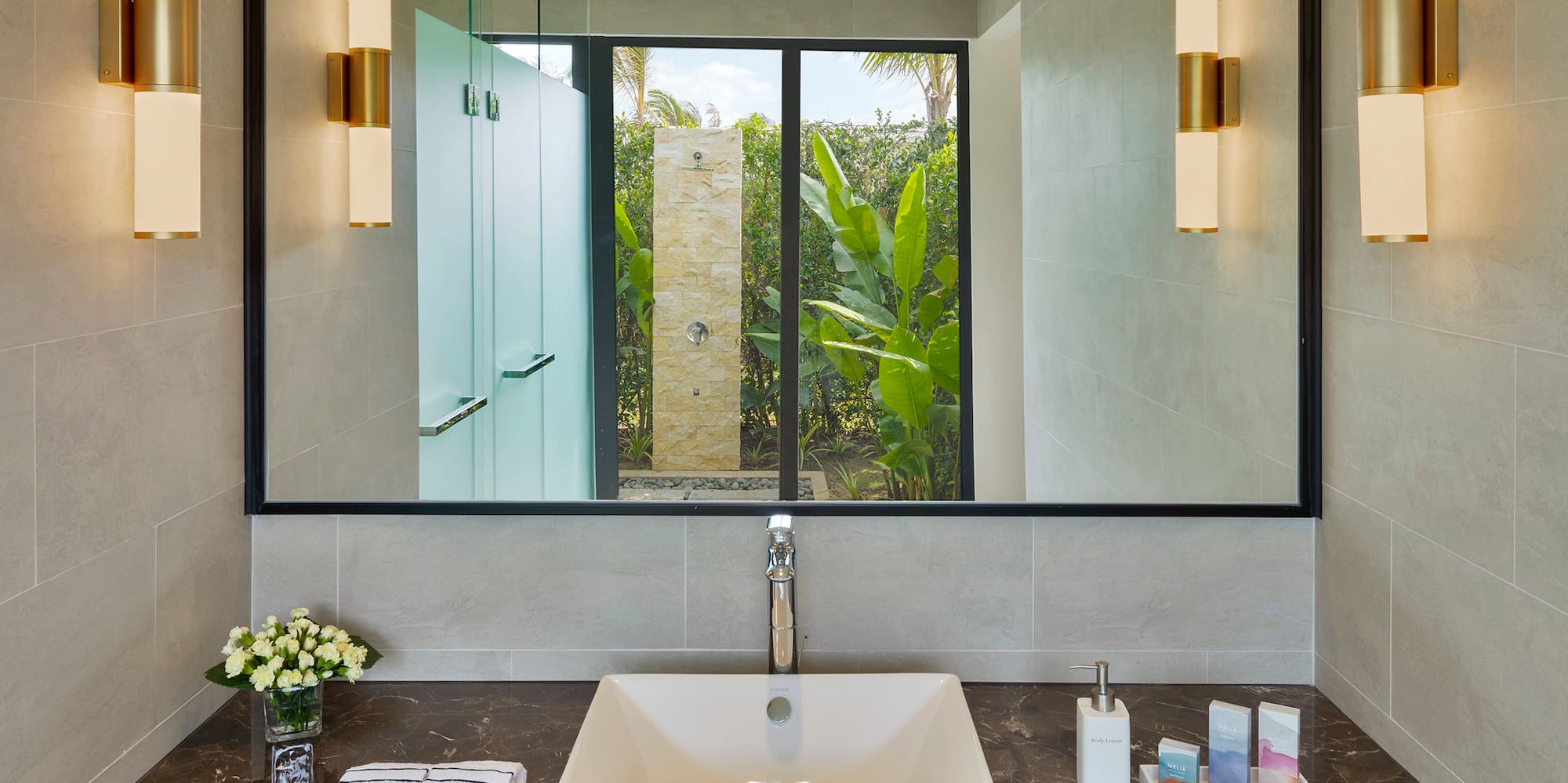 a bathroom with a mirror and sink