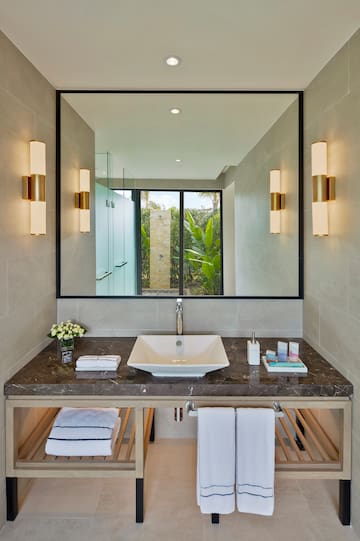 a bathroom with a mirror and sink