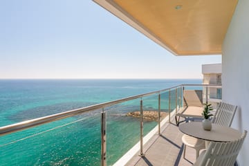 a balcony overlooking the ocean