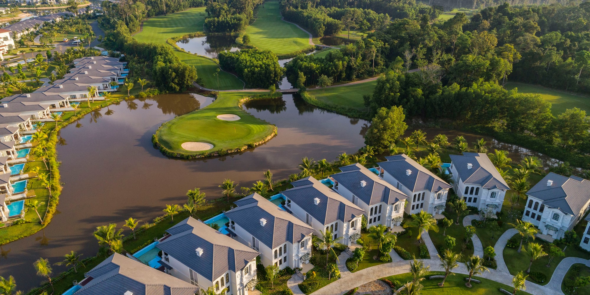 a group of houses next to a river