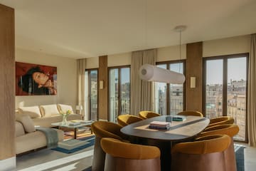 a room with a table and chairs