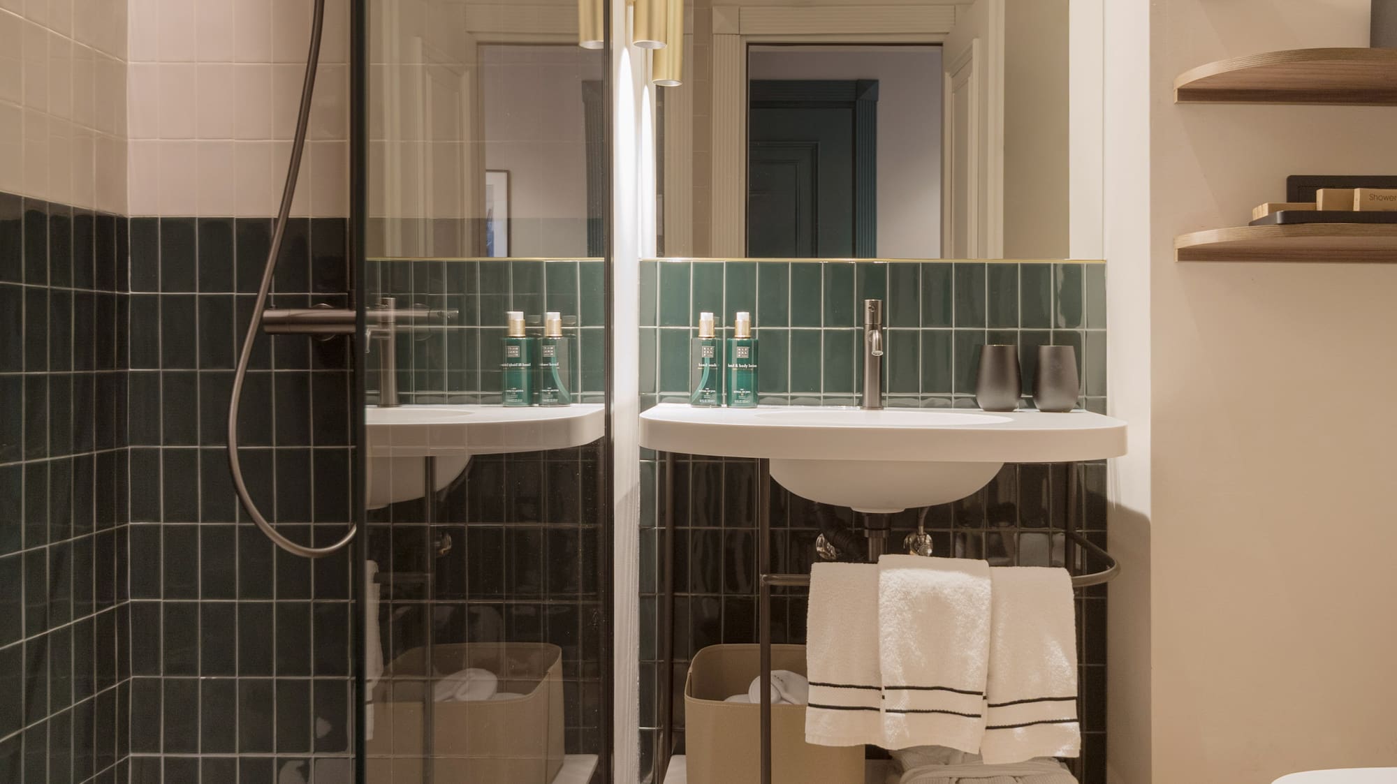 a bathroom with a glass shower door