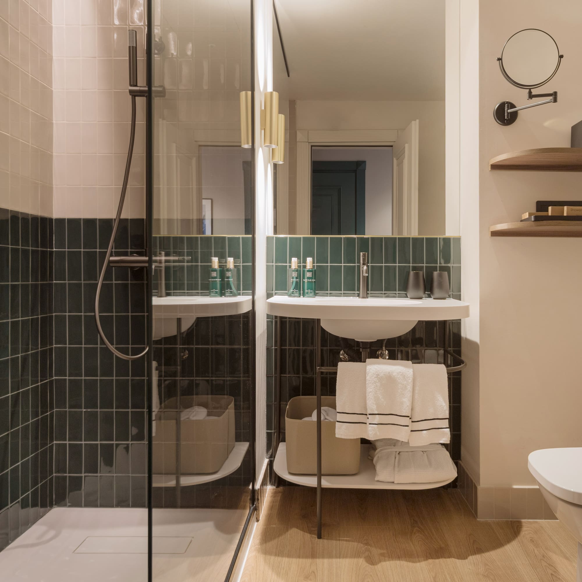 a bathroom with a glass shower door