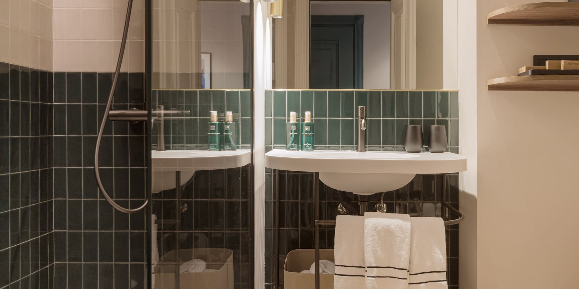 a bathroom with a glass shower door