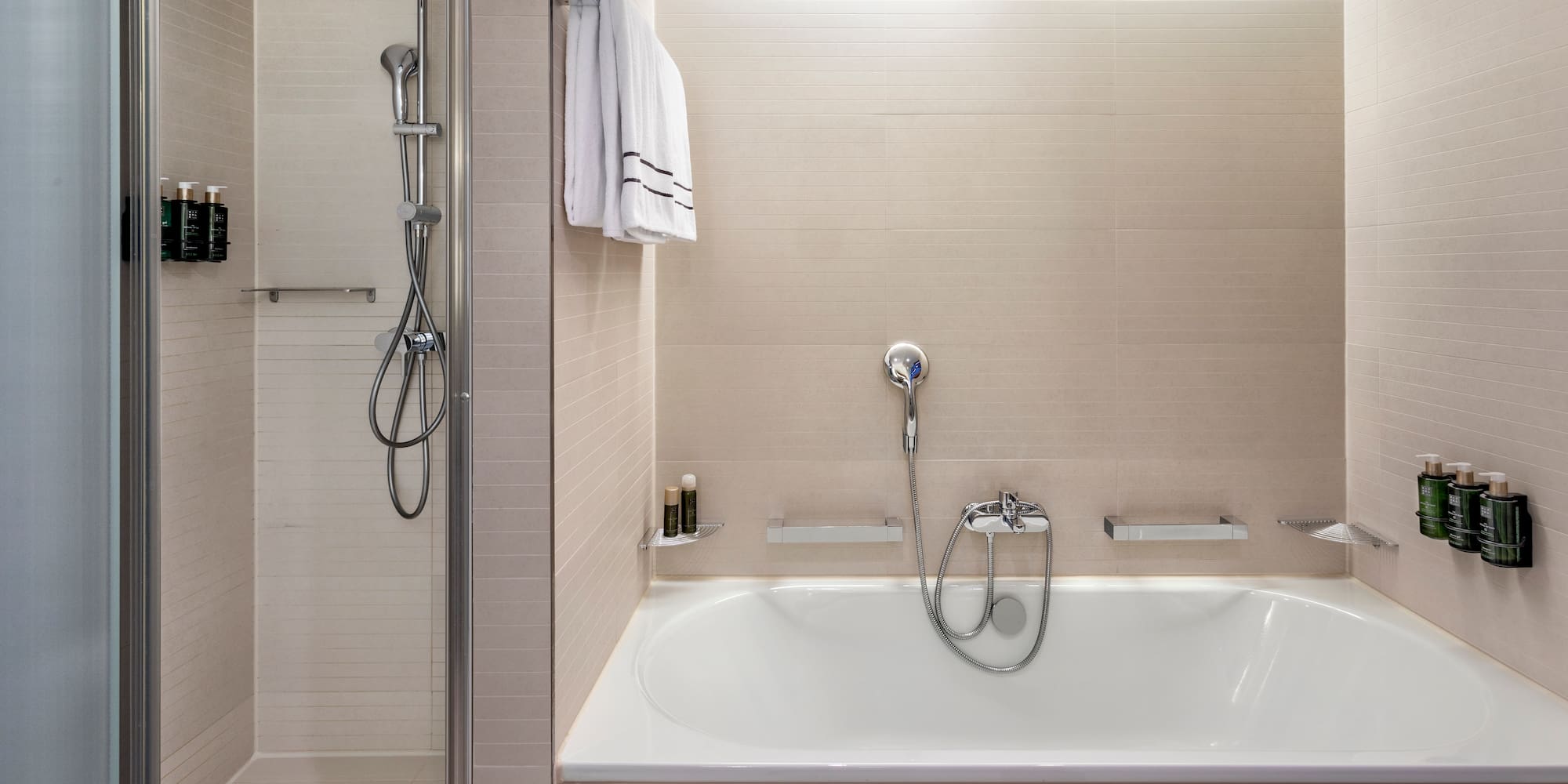 a bathtub and shower in a bathroom