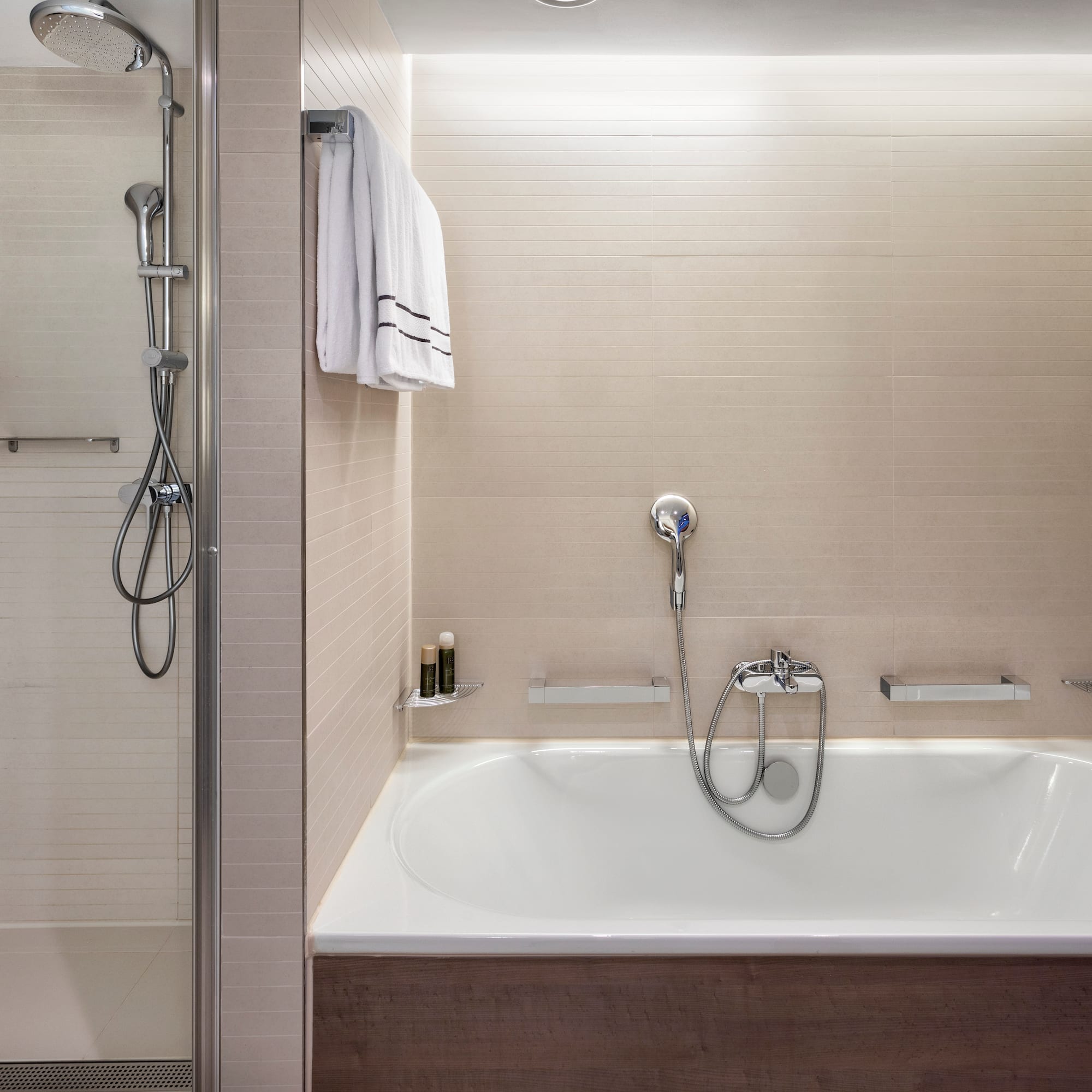 a bathtub and shower in a bathroom