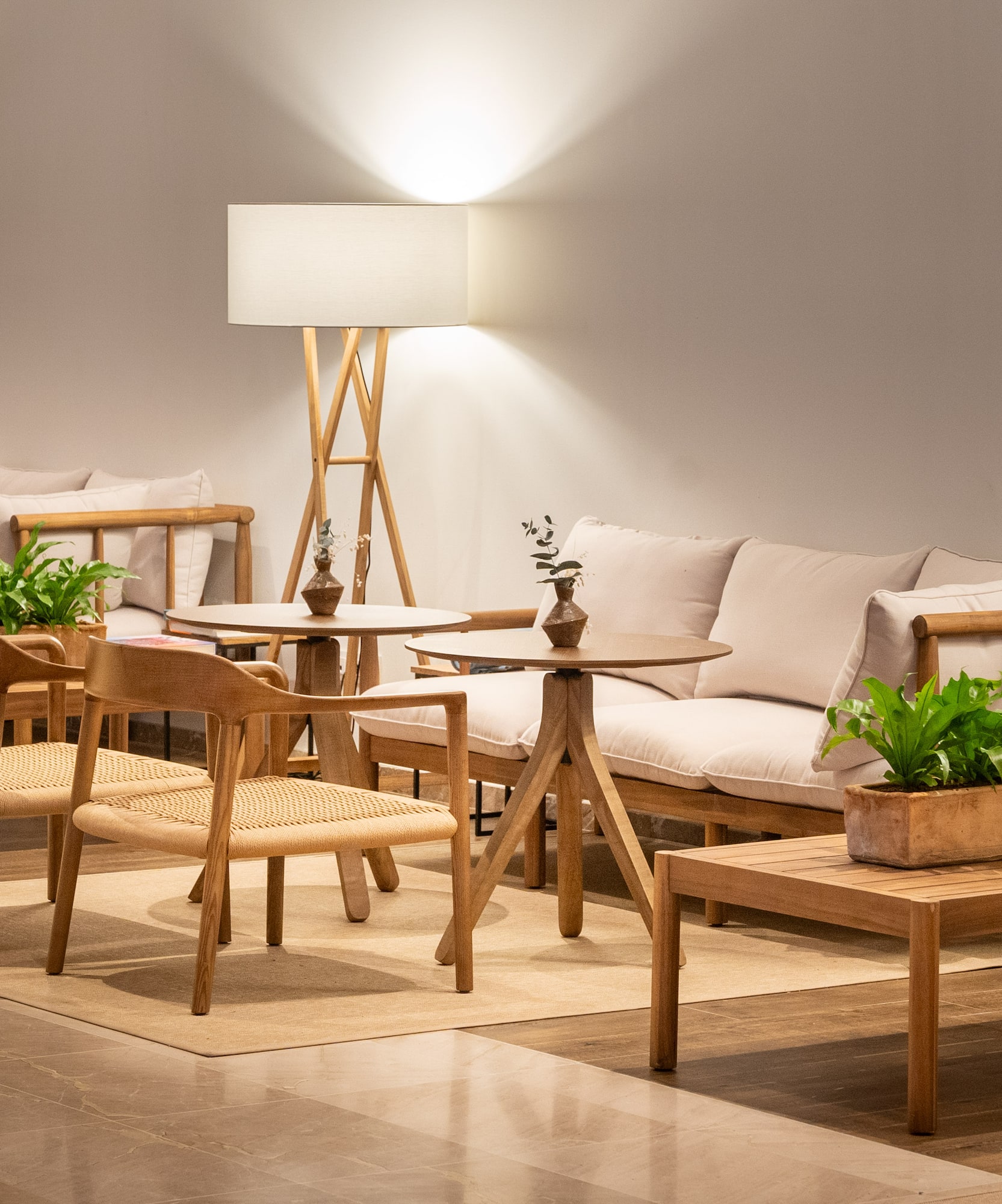 a room with a couch and chairs