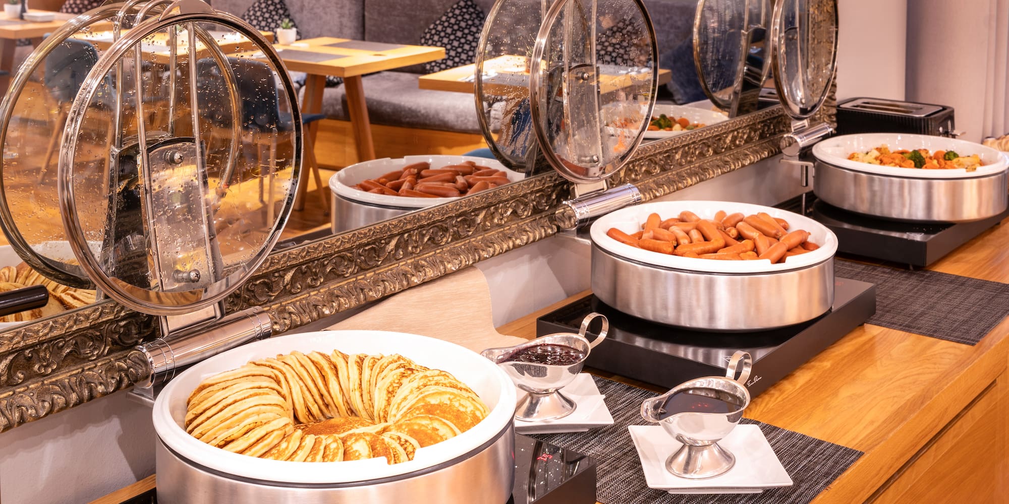 food in a buffet with a mirror