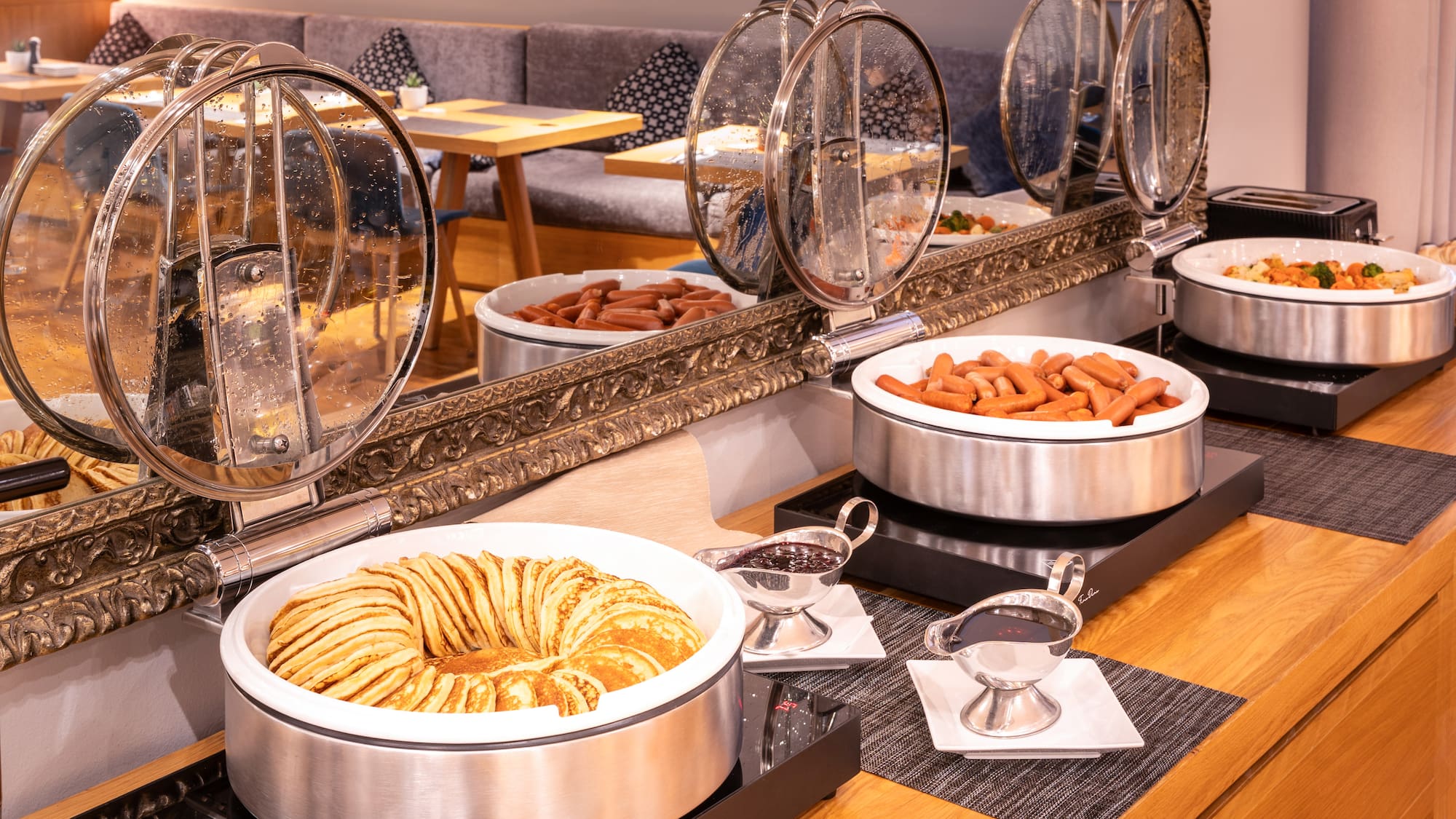 food in a buffet with a mirror