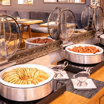 food in a buffet with a mirror