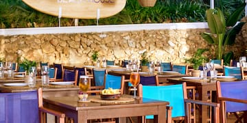 a restaurant with tables and chairs