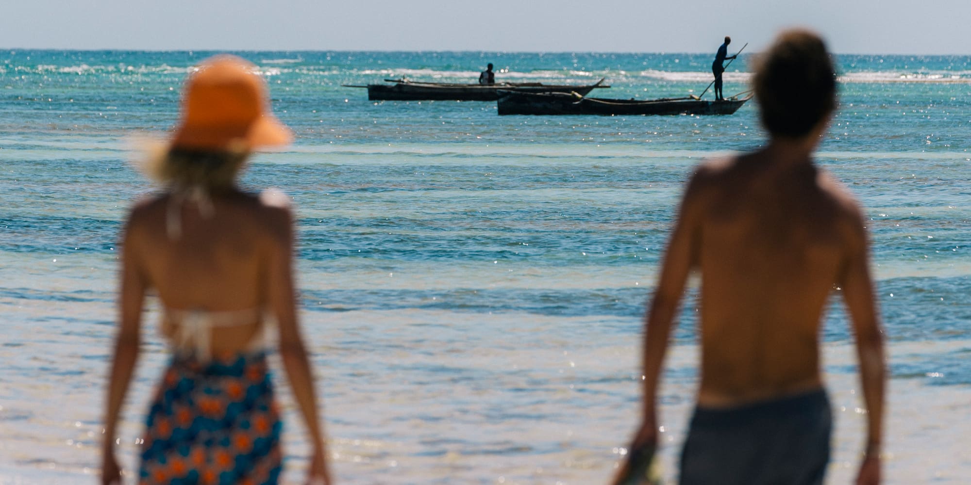 a couple walking on a beach