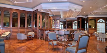 a room with chairs and tables