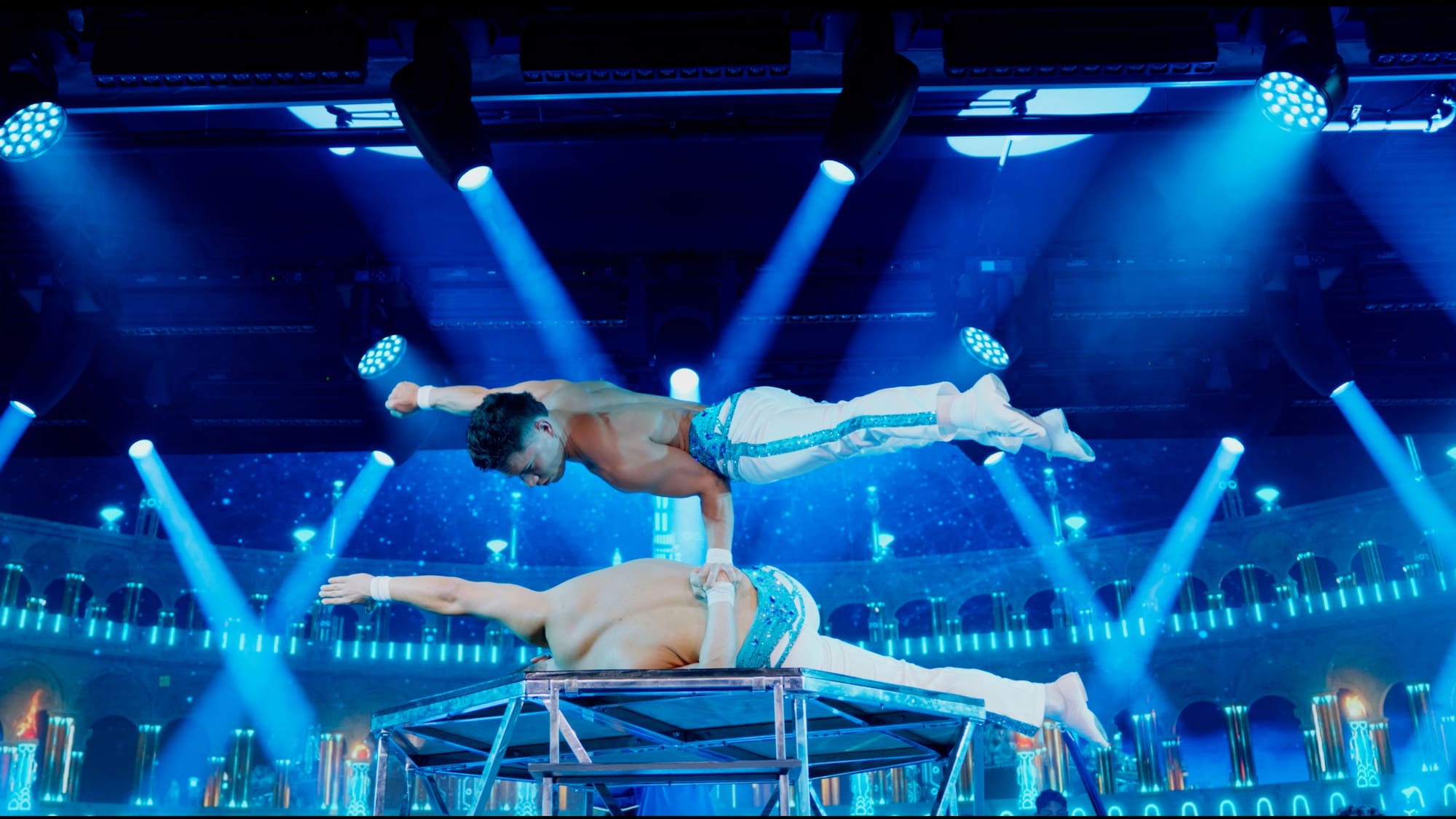 a man standing on another man's back