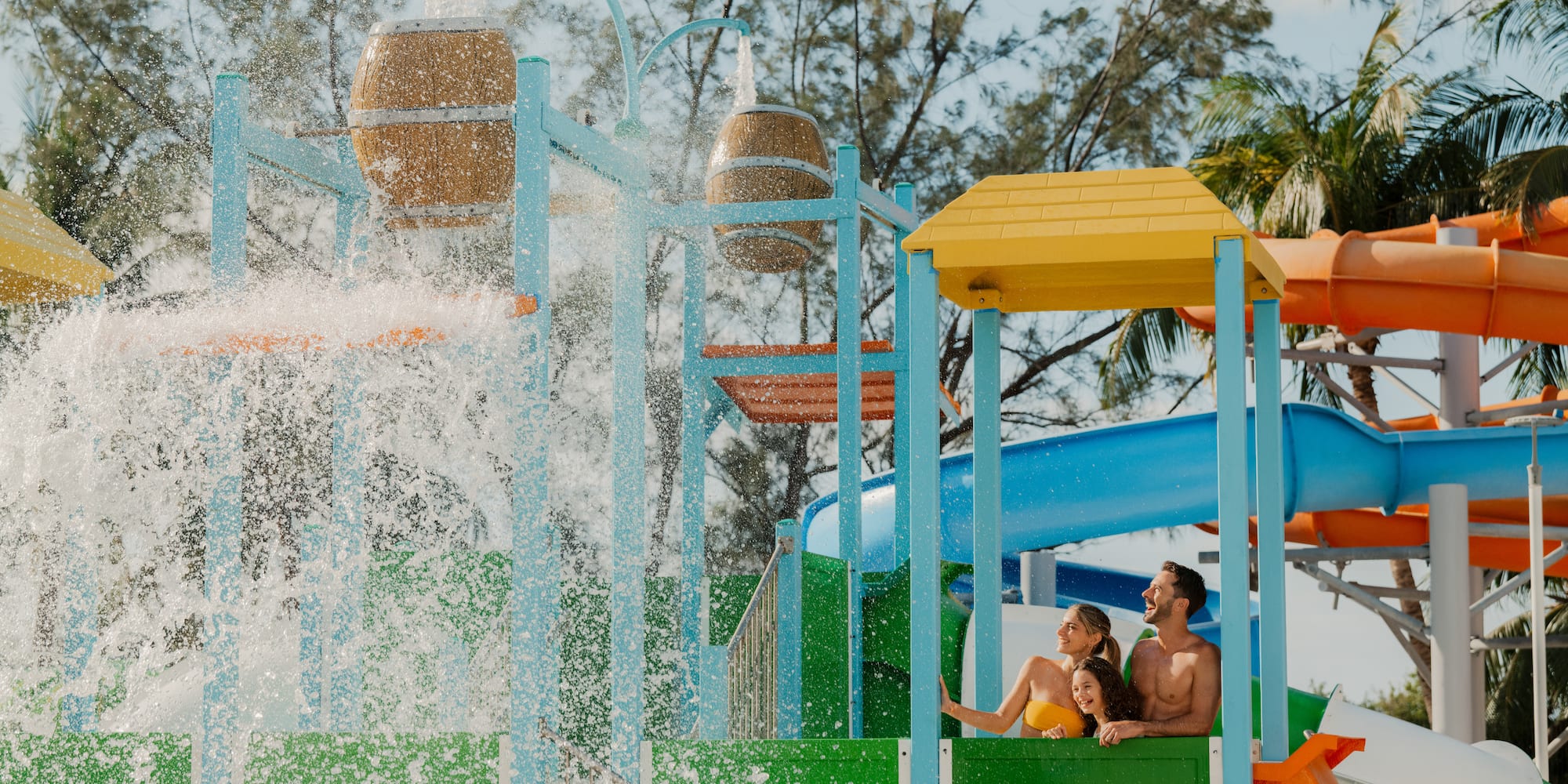 a group of people on a water slide