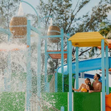 a group of people on a water slide