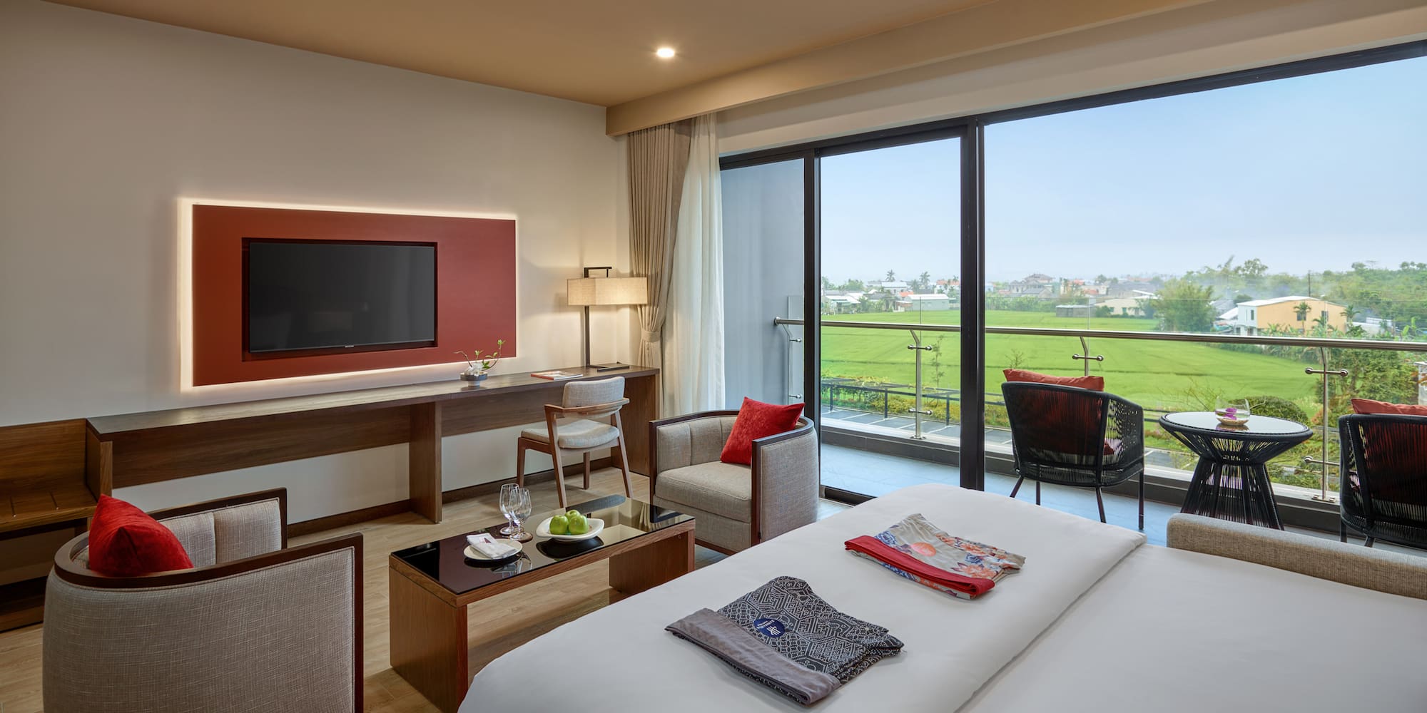 a room with a television and a golf course view